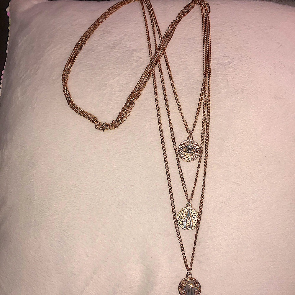 This is a LAYERED PROTECTIVE POSITIVITY NECKLACE
